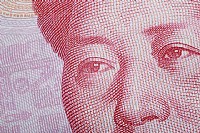 百元大钞微距-33年里人民币货币贬值6倍多